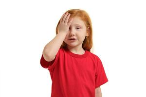 Portrait of cute redhead emotional little girl facepalming isolated on a white photo