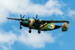 Polish Air Force PZL M28 Bryza transport plane flying. Aviation and military aircraft. photo