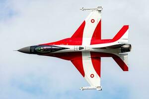 Royal Danish Air Force Lockheed F-16 Fighting Falcon fighter jet plane flying. Aviation and military aircraft. photo