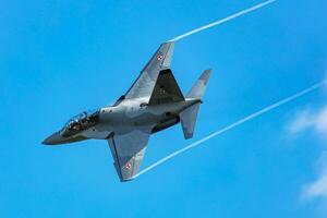 Polish Air Force Leonardo M-346 Master Bielik trainer jet plane flying. Aviation and military aircraft. photo