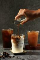 Pour Espresso making Iced Coffee Latte photo