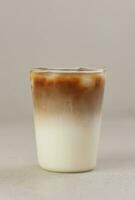 Iced Coffee Latte on Cream Background photo