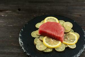 Fresh Tuna Raw Steak on Lemon Slice photo