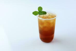 Iced Tea or Es Teh with Mint Leaf photo