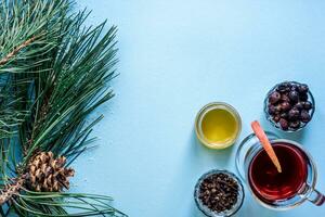 Mulled wine with spices on blue background photo