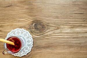 Mulled wine with spices on wooden background photo