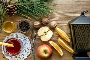 Christmas Mulled wine with spices on wooden background photo