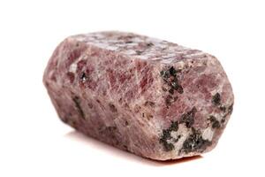Macro mineral stone Ruby in the breed a white background photo