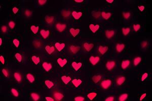 hermosa corazones hecho de luces en un borroso antecedentes foto
