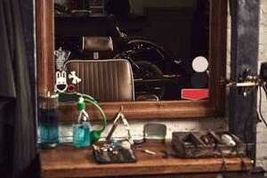 Barbershop tools on wooden brown table. Accessories for shaving and haircuts on the table. photo
