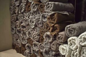 Clean towels on the shelf in barbershop. photo