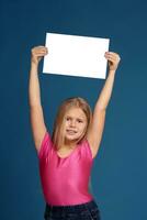 Portrait of adorable emotional little girl on blue background photo