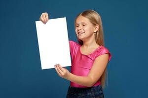 Portrait of adorable emotional little girl on blue background photo