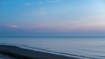 Landscape during night sunset at the border of the sea photo