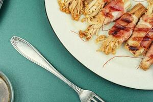 Grilled enoki mushroom with bacon photo