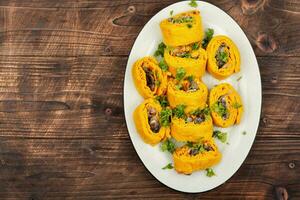 Pumpkin rolls with mushrooms photo