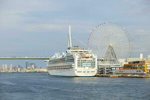 osaka japan - november8,2018 princes cruises luxuri cruising ship approach on port of tempozan osaka photo