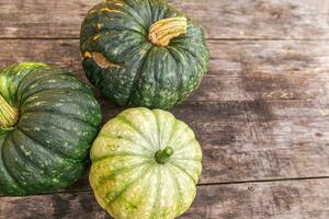 Autumnal Background. Natural autumn fall view pumpkins on wooden background. Inspirational october or september wallpaper. Change of seasons ripe organic food concept, Halloween party Thanksgiving day photo