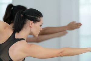 Group of people practicing yoga in a studio. Yoga class concept. photo