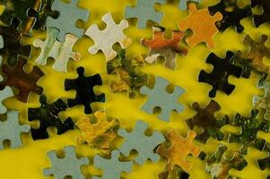 a yellow background with a puzzle piece on it photo