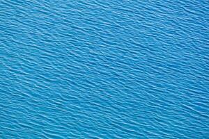 the surface of the water is blue and smooth photo