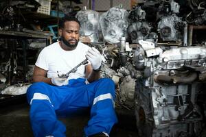 Men repairing car engine in auto repair shop, Selective focus. photo