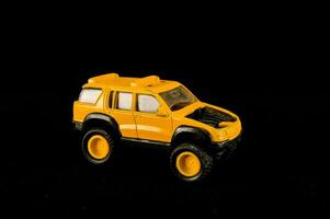 a toy vehicle is shown on a black background photo