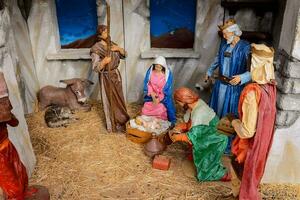 a nativity scene with a manger, a manger, and a sheep photo