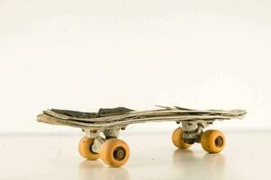 a skateboard made out of newspaper and wood photo
