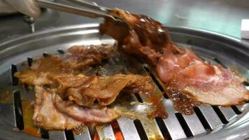 Raw beef and pork slice on grille for barbecue video