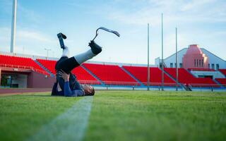 Athletes with disabilities take a break at the stadium between training sessions. photo