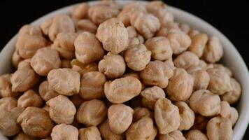 Chickpeas vegetables gyrating on a bowl video