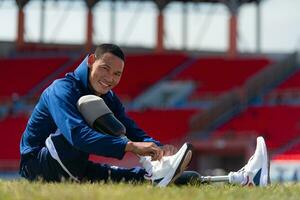 Athletes with disabilities take a break at the stadium between training sessions. photo