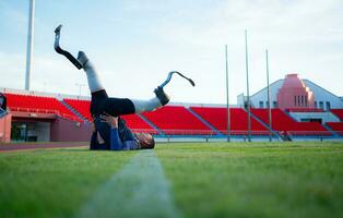 Athletes with disabilities take a break at the stadium between training sessions. photo