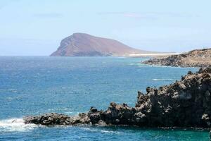 the rocky coastline of the island of galicia photo