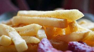 hand pick French Fries on table video