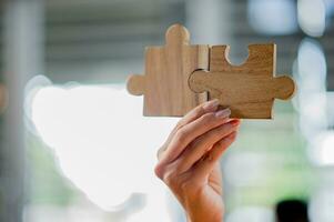 Jigsaw puzzle pieces are important to work on. Team unity Teamwork wooden parts photo