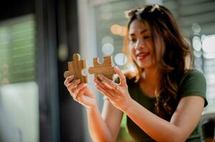 Jigsaw puzzle pieces are important to work on. Team unity Teamwork wooden parts photo