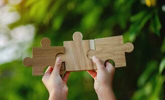 jigsaw puzzle pieces Unity and teamwork Communication wooden parts photo