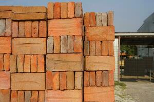 Plant for the production of bricks from clay. Plant for production building material with ready brick, construction industrial photo