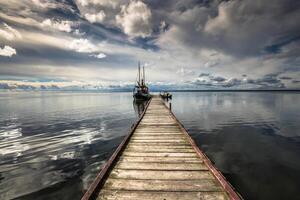 wooden pier in the sunset photo