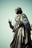 Monument of great astronomer Nicolaus Copernicus, Torun, Poland photo