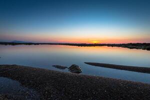 Sunset on the beach with beautiful sky photo