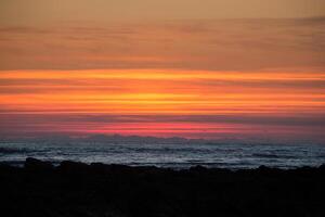 Sunset on the beach with beautiful sky photo