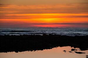 Sunset on the beach with beautiful sky photo