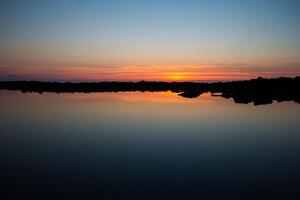 Sunset on the beach with beautiful sky photo