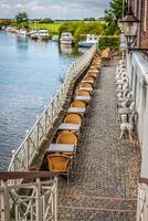 lot of chairs and tables on a terrace photo