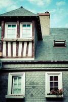 Stylized half-timbered house. Etretat is a commune in the Seine photo