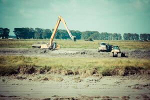 excavator on new construction site photo