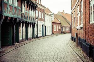 Street with old houses from royal town Ribe in Denmark photo